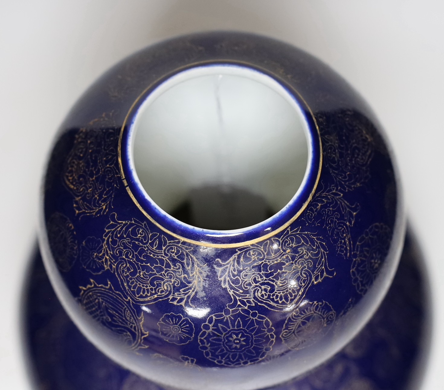 A large Chinese gilt decorated blue glazed double gourd vase, 31cm